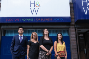 Hartley and Worstenholme solicitors in front of their offices